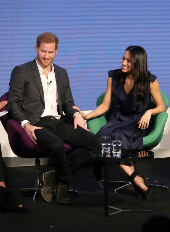  (credit photo POOL/AFP) Le prince Harry et sa fiancée américaine Meghan Markle. Leur mariage est prévu en mai. Le 28 février 2018 à Londres.